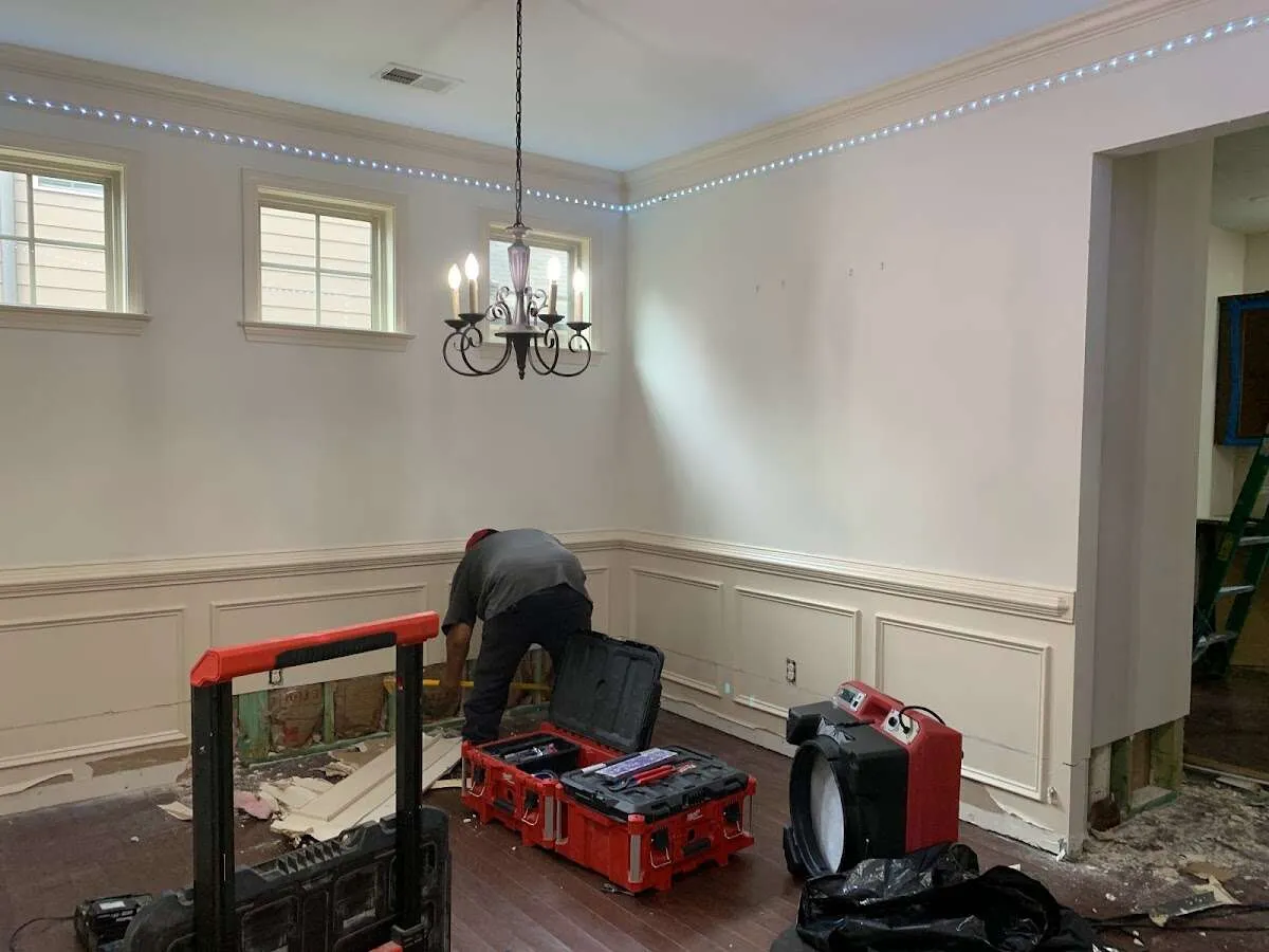 Restoration technician with professional equipment in Holly Springs